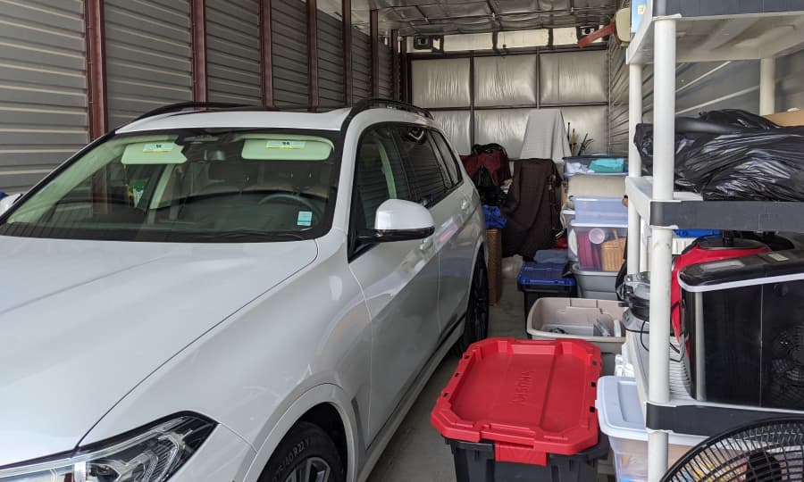 Whole home stored in unit with BMW SUV organized
